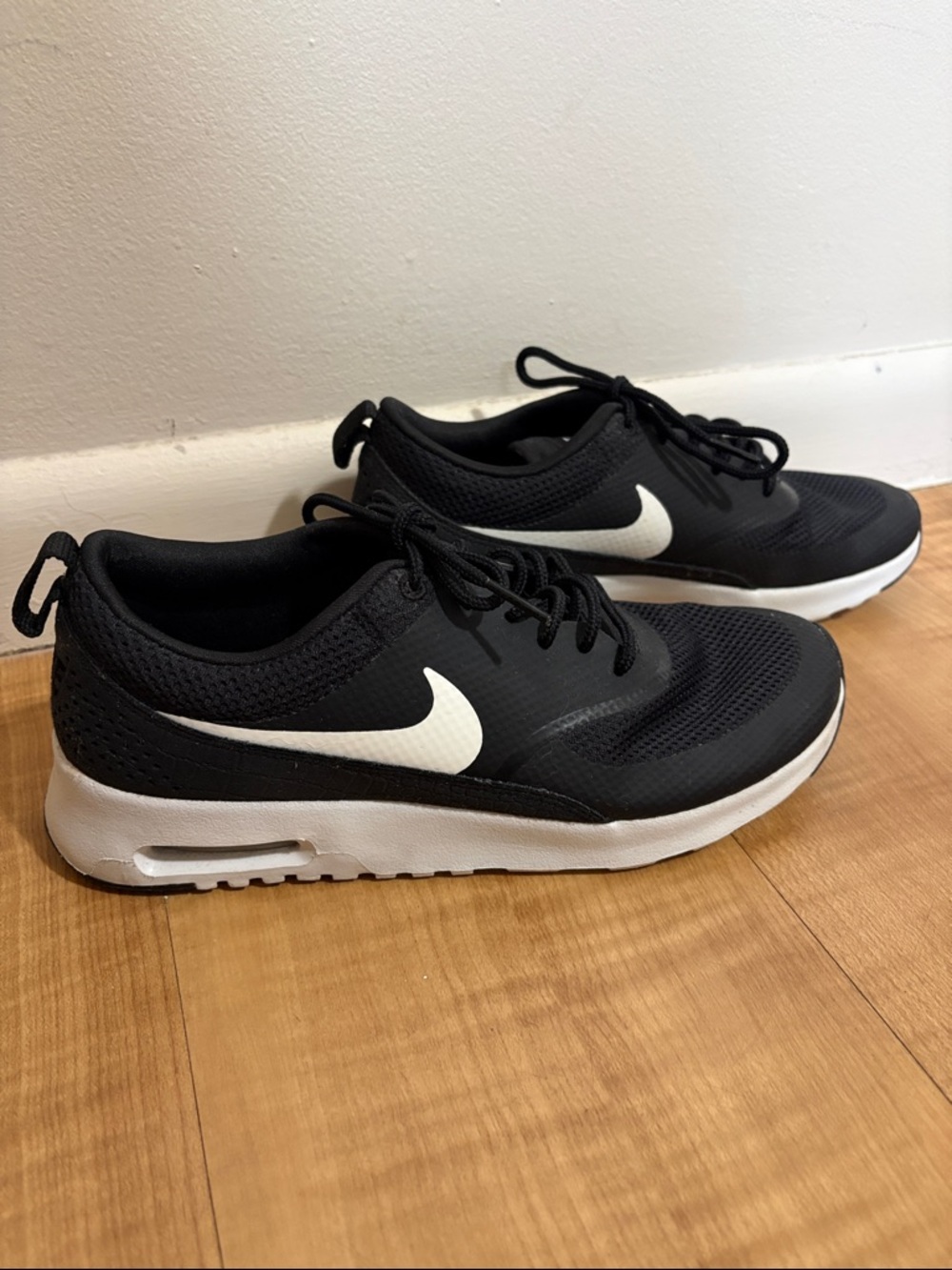 Women’s Nike Black Sneakers with White Swoosh